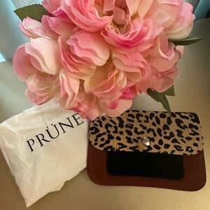 Prune brand new leather women’s hand bag with it’s bag.